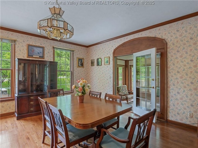 14 Woodclyffe Rd, Hurricane, WV 25526 - dining room featuring wallpapered walls, light wood-type flooring, baseboards, ornamental molding, and a chandelier