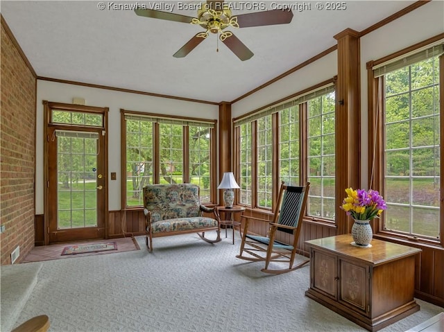 14 Woodclyffe Rd, Hurricane, WV 25526 - sunroom / solarium featuring healthy amount of natural light, brick wall, crown molding, and carpet flooring