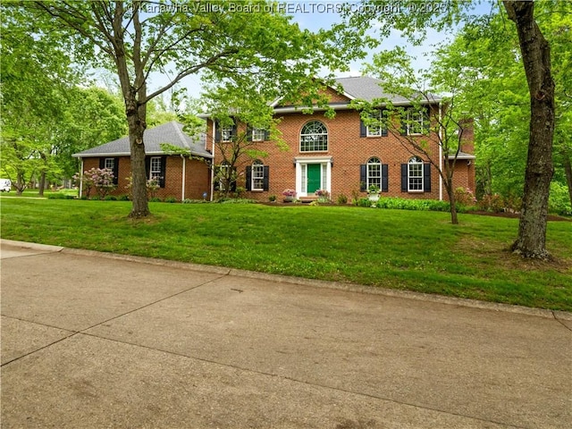 14 Woodclyffe Rd, Hurricane, WV 25526 - view of front of house featuring a front lawn and brick siding
