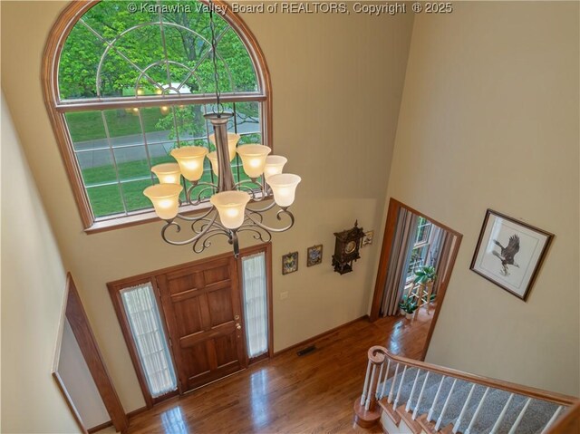 14 Woodclyffe Rd, Hurricane, WV 25526 - entrance foyer with a towering ceiling, wood finished floors, and a chandelier