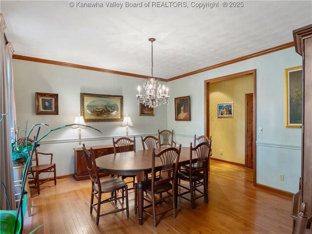 14 Woodclyffe Rd, Hurricane, WV 25526 - dining space featuring light wood-style flooring, a chandelier, and baseboards