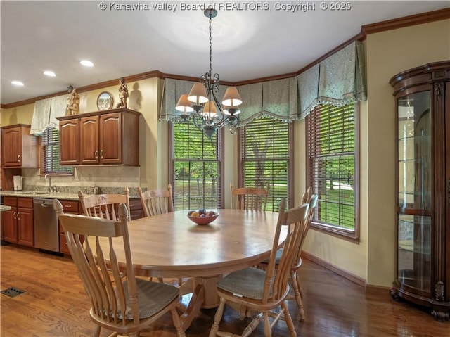 14 Woodclyffe Rd, Hurricane, WV 25526 - dining area featuring ornamental molding, light wood-style floors, a chandelier, baseboards, and recessed lighting