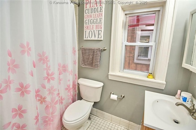 1313 Lee St E Unit 231, Charleston, WV 25301 - bathroom with toilet, tile patterned flooring, vanity, baseboards, and curtained shower