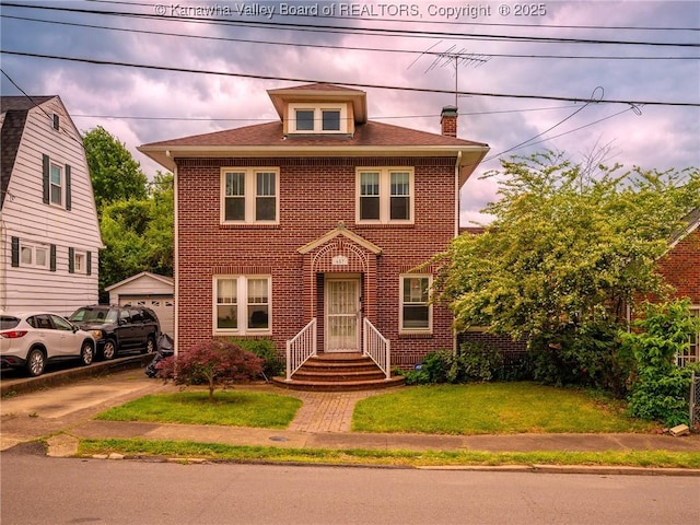 657 Beech Ave, Charleston, WV 25302 - american foursquare style home with brick siding, a chimney, a front yard, and an outbuilding