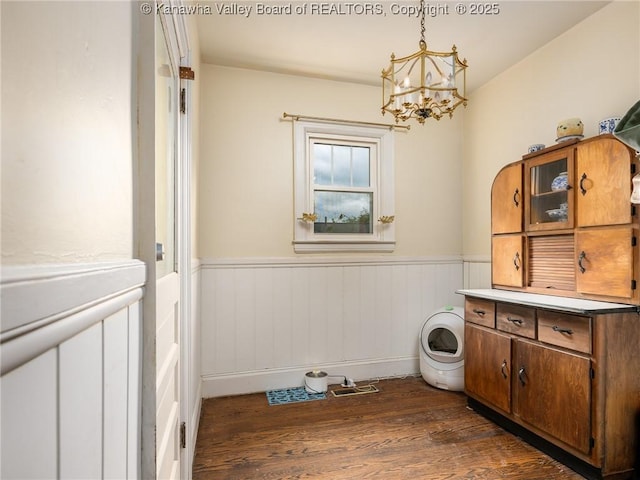 657 Beech Ave, Charleston, WV 25302 - washroom featuring dark wood-style flooring, a chandelier, a wainscoted wall, and washer / clothes dryer