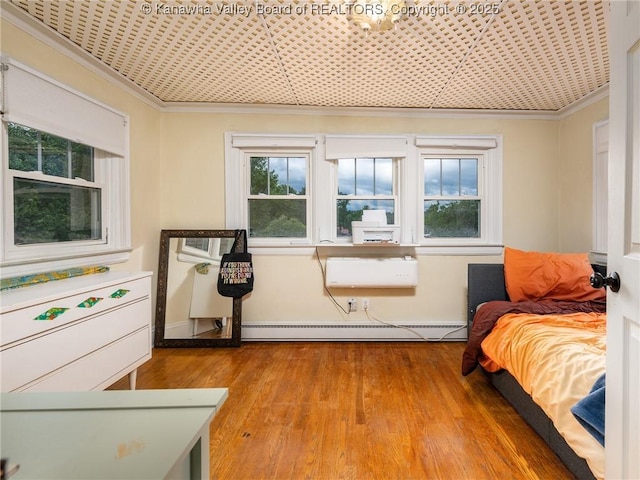 657 Beech Ave, Charleston, WV 25302 - bedroom featuring ornamental molding, a baseboard radiator, hardwood / wood-style flooring, and an ornate ceiling