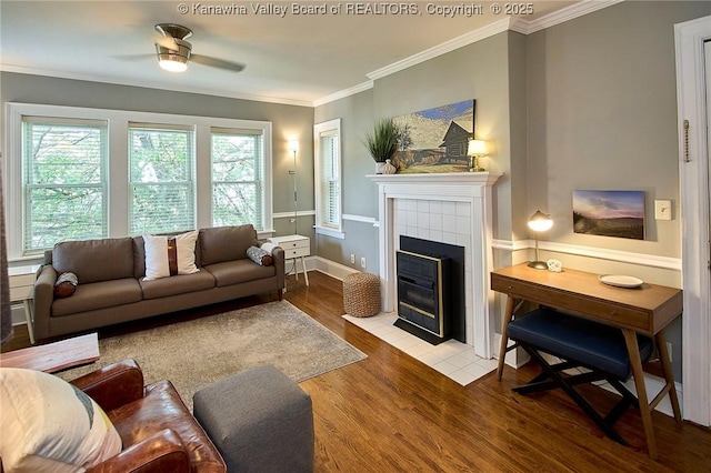 1313 Lee St E Unit 233, Charleston, WV 25301 - living area featuring wood finished floors, crown molding, ceiling fan, and a tile fireplace