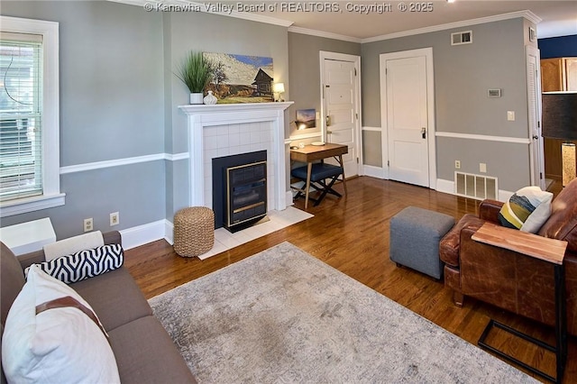 1313 Lee St E Unit 233, Charleston, WV 25301 - living area with wood finished floors, a fireplace, baseboards, and crown molding