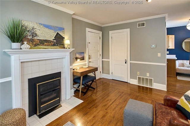 1313 Lee St E Unit 233, Charleston, WV 25301 - living area with a fireplace, wood finished floors, ornamental molding, and baseboards