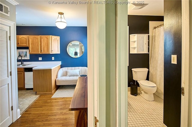 1313 Lee St E Unit 233, Charleston, WV 25301 - full bathroom with toilet, wood finished floors, and vanity