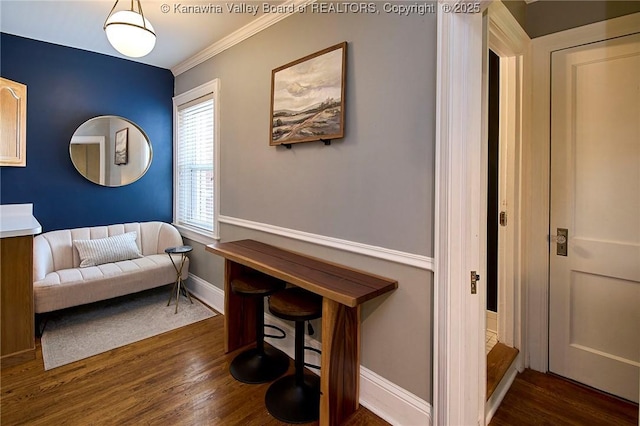 1313 Lee St E Unit 233, Charleston, WV 25301 - living area with wood finished floors, crown molding, and baseboards