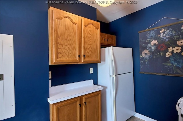 1313 Lee St E Unit 233, Charleston, WV 25301 - kitchen with freestanding refrigerator and light countertops