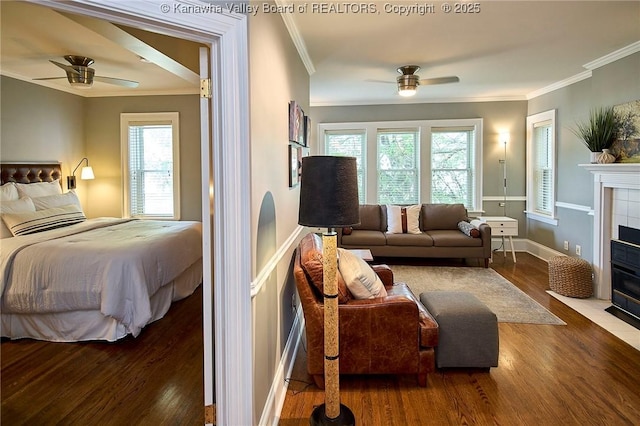 1313 Lee St E Unit 233, Charleston, WV 25301 - bedroom with wood finished floors, crown molding, a fireplace, multiple windows, and ceiling fan