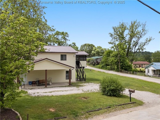67 Poplar Dr, Scott Depot, WV 25560 - view of grassy yard with a patio area and stairs