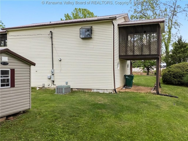 67 Poplar Dr, Scott Depot, WV 25560 - view of side of property with metal roof, a yard, a sunroom, and central AC unit