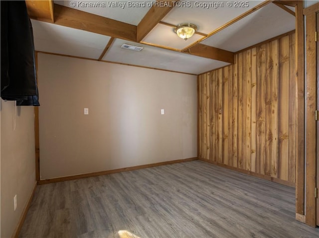 67 Poplar Dr, Scott Depot, WV 25560 - spare room with wood finished floors, wooden walls, and baseboards