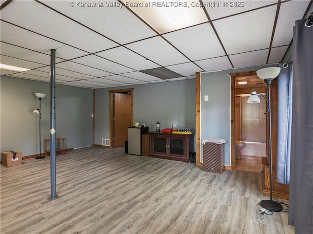 67 Poplar Dr, Scott Depot, WV 25560 - basement with wood finished floors, a paneled ceiling, and baseboards