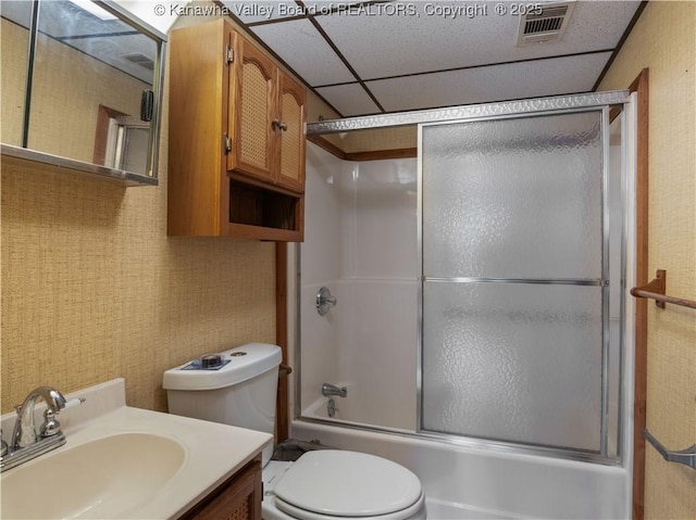 67 Poplar Dr, Scott Depot, WV 25560 - bathroom featuring toilet, bath / shower combo with glass door, vanity, and a drop ceiling