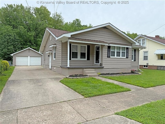 2111 21st St, Nitro, WV 25143 - bungalow-style home featuring a garage, an outdoor structure, a front yard, covered porch, and roof with shingles