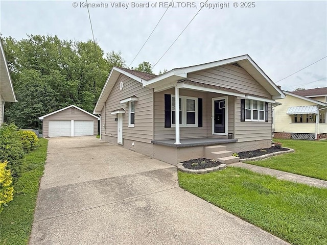2111 21st St, Nitro, WV 25143 - bungalow-style home with a porch, a garage, an outdoor structure, and a front lawn