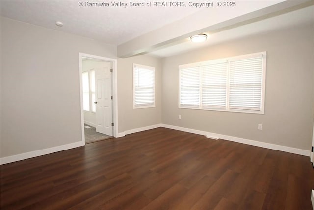 2111 21st St, Nitro, WV 25143 - unfurnished room with baseboards and dark wood-type flooring