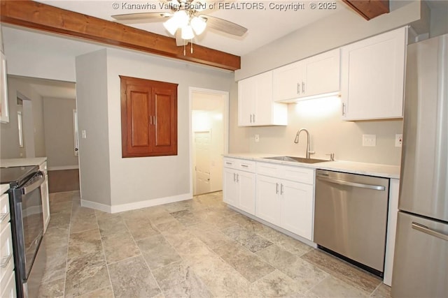 2111 21st St, Nitro, WV 25143 - kitchen with stainless steel appliances, a sink, a ceiling fan, light countertops, and beam ceiling