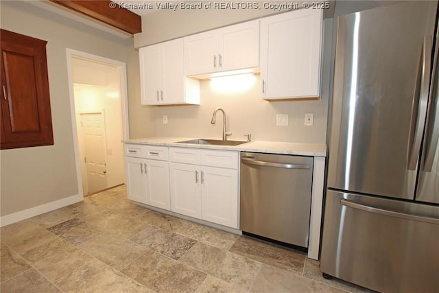 2111 21st St, Nitro, WV 25143 - kitchen with appliances with stainless steel finishes, a sink, light stone finish floors, light countertops, and white cabinetry