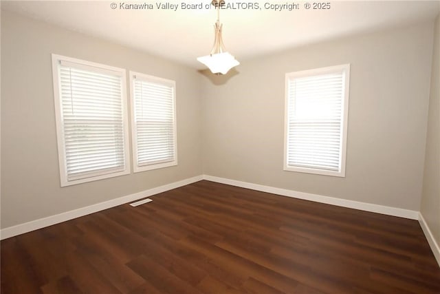2111 21st St, Nitro, WV 25143 - empty room featuring baseboards and dark wood-style floors
