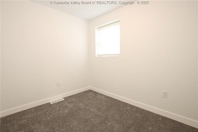 2111 21st St, Nitro, WV 25143 - unfurnished room with dark carpet and baseboards