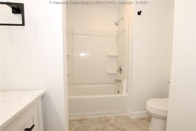 2111 21st St, Nitro, WV 25143 - full bathroom with vanity, toilet, shower / washtub combination, and baseboards