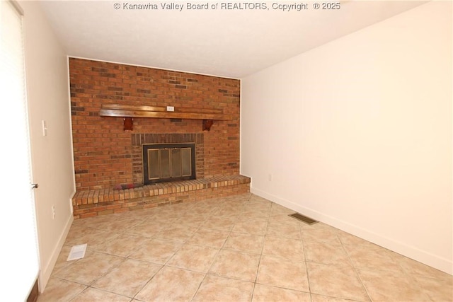2111 21st St, Nitro, WV 25143 - unfurnished living room featuring light tile patterned floors, a fireplace, and baseboards
