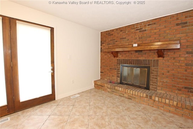 2111 21st St, Nitro, WV 25143 - unfurnished living room featuring light tile patterned floors, a fireplace, and baseboards
