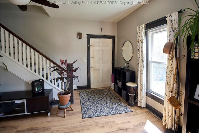 918 Greendale Dr, Charleston, WV 25302 - entrance foyer with stairway, wood finished floors, ceiling fan, and baseboards