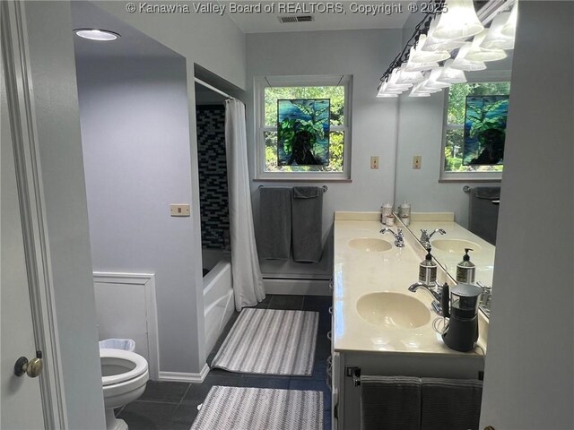 814 Skinner Dr, Saint Albans, WV 25177 - bathroom featuring tile patterned flooring, toilet, healthy amount of natural light, and double vanity
