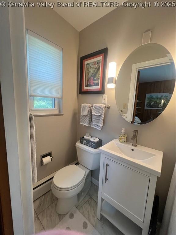 814 Skinner Dr, Saint Albans, WV 25177 - half bath featuring vanity, a baseboard heating unit, toilet, and marble look tile flooring