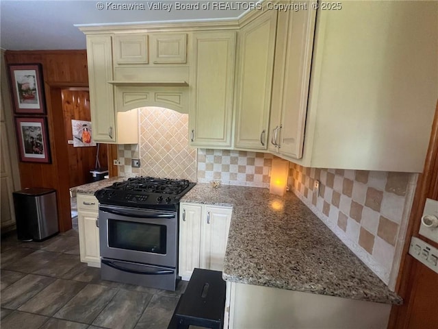 814 Skinner Dr, Saint Albans, WV 25177 - kitchen with stainless steel gas range oven, cream cabinets, decorative backsplash, and light stone countertops