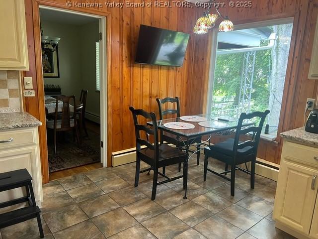 814 Skinner Dr, Saint Albans, WV 25177 - dining room featuring wooden walls, a baseboard radiator, and baseboard heating