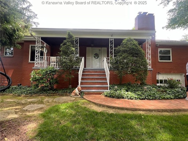814 Skinner Dr, Saint Albans, WV 25177 - view of front of home with covered porch, brick siding, and a chimney