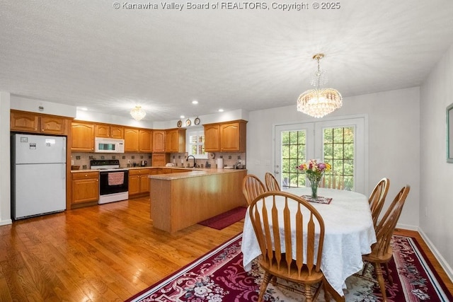 108 Lock Ln, Alum Creek, WV 25003 - dining space with a chandelier, light wood-style floors, recessed lighting, and baseboards