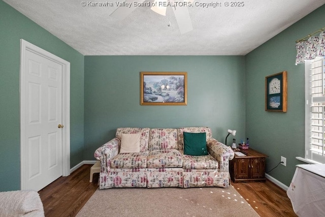 108 Lock Ln, Alum Creek, WV 25003 - living room featuring a ceiling fan, wood finished floors, baseboards, and a textured ceiling