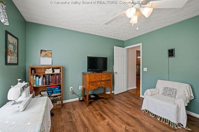 108 Lock Ln, Alum Creek, WV 25003 - living area featuring wood finished floors, baseboards, ceiling fan, and a textured ceiling