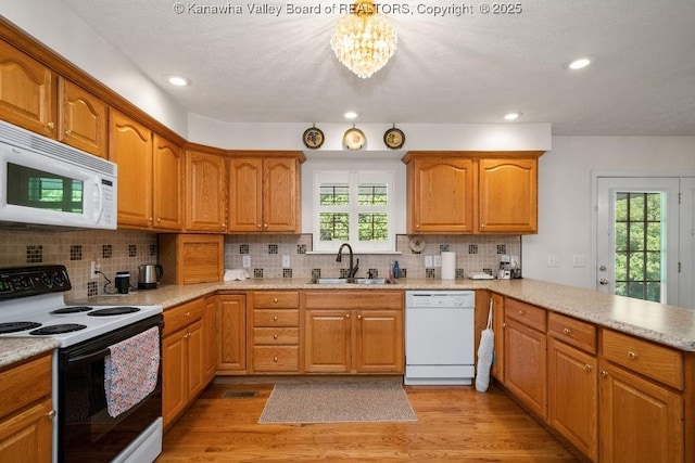 108 Lock Ln, Alum Creek, WV 25003 - kitchen featuring white appliances, a sink, a peninsula, healthy amount of natural light, and recessed lighting