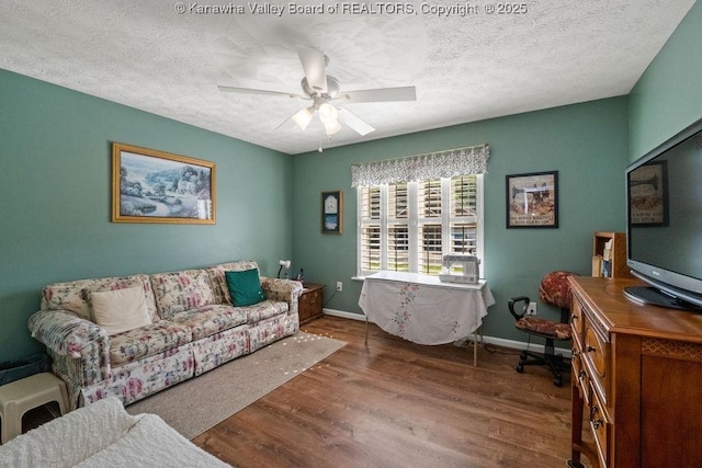 108 Lock Ln, Alum Creek, WV 25003 - living area featuring wood finished floors, a ceiling fan, a textured ceiling, and baseboards