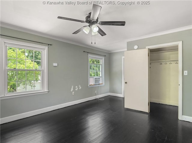 1300 Enslow Blvd, Huntington, WV 25701 - unfurnished bedroom with baseboards, dark wood-type flooring, a spacious closet, crown molding, and a closet