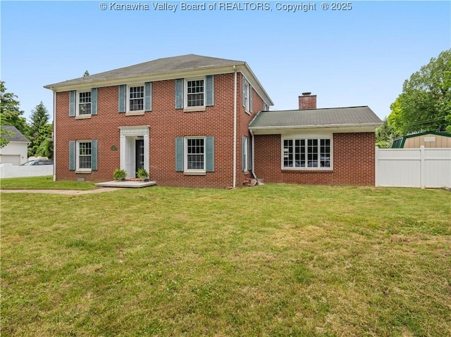 1300 Enslow Blvd, Huntington, WV 25701 - colonial-style house featuring a chimney and brick siding