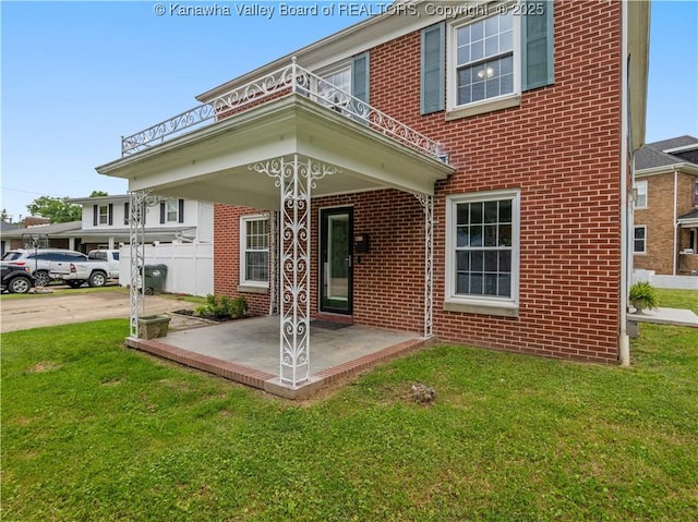 1300 Enslow Blvd, Huntington, WV 25701 - property entrance with brick siding and a yard