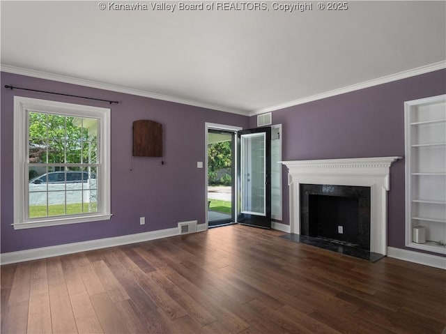 1300 Enslow Blvd, Huntington, WV 25701 - unfurnished living room with healthy amount of natural light, wood finished floors, baseboards, crown molding, and built in shelves