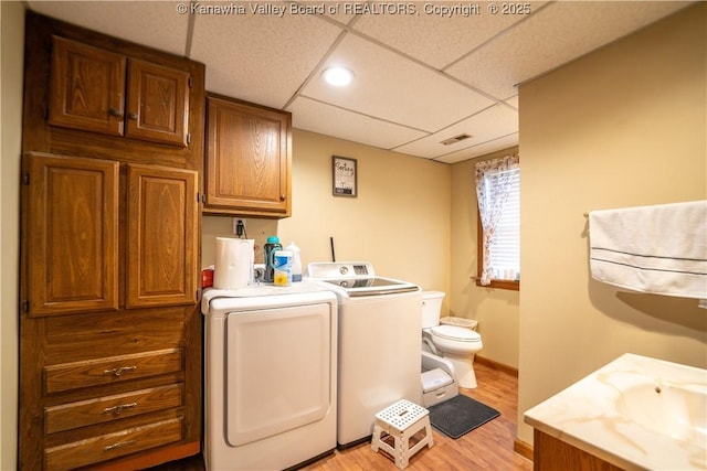 400 13th St, Dunbar, WV 25064 - laundry area with independent washer and dryer, light wood-style flooring, and baseboards