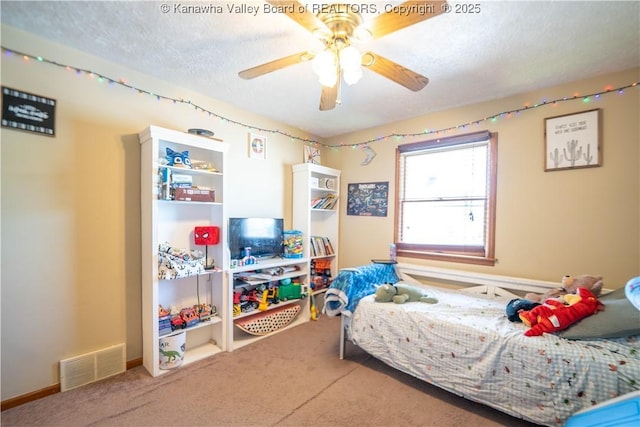 400 13th St, Dunbar, WV 25064 - carpeted bedroom with a textured ceiling and a ceiling fan