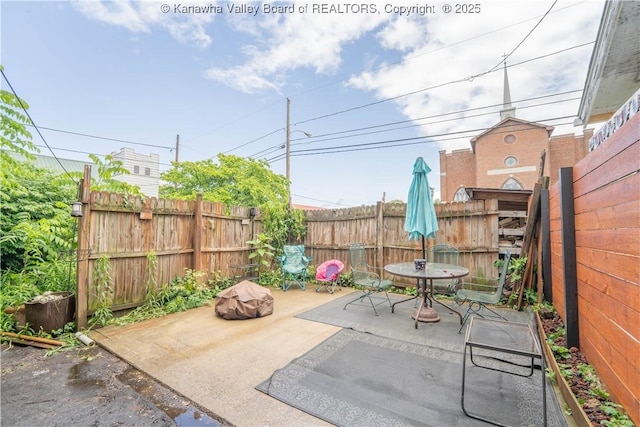 400 13th St, Dunbar, WV 25064 - fenced backyard featuring a patio area